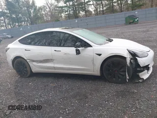 2021 Tesla Model 3 Long Range with VIN 5YJ3E1EB8MF974007, listed as a IAAI auction lot 41915513 with 107,354 mi miles and . Bid and sale history available at carsss.com. Image 13.