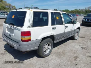 1996 Jeep Grand Cherokee Laredo with VIN 1J4EX58S6TC126610, listed as a IAAI auction lot 41801779 with 1 mi miles. Bid and sale history available at carsss.com. Image 4.