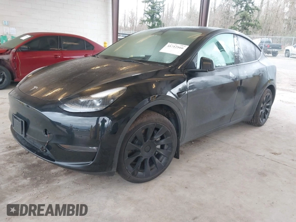 2023 Tesla Model Y Long Range with VIN 7SAYGAEEXPF707503, listed as a IAAI auction lot 41712166 with 27,467 mi miles and . Bid and sale history available at carsss.com. Image 17.