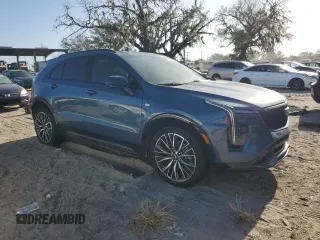2024 Cadillac XT4 FWD Sport with VIN 1GYFZER40RF249101, listed as a Copart auction lot 76312304 with 1,969 mi miles and Salvage title. Bid and sale history available at DreamBid. Image 4.