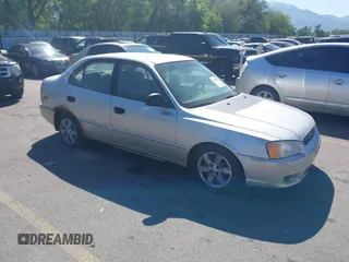2002 Hyundai Accent GL z VIN KMHCG45C62U336245, wystawiony jako IAAI lot #42312838 z przebiegiem 310 753 mil mil oraz . Historia ofert i sprzedaży dostępna na DreamBid. Obrazek 1.