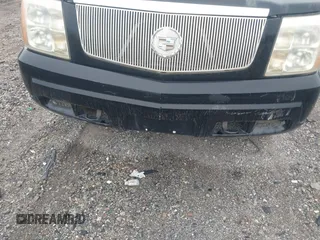 2003 Cadillac Escalade z VIN 1GYEK63N13R140496, wystawiony jako IAAI lot #42366303 z przebiegiem 90 940 mil mil oraz . Historia ofert i sprzedaży dostępna na DreamBid. Obrazek 6.