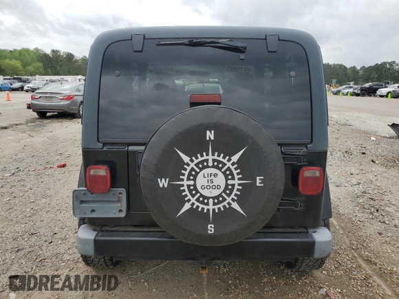 2002 Jeep Wrangler Sahara with VIN 1J4FA59S22P771136, listed as a Copart auction lot 51528665 with 236,882 mi miles and Salvage title. Bid and sale history available at DreamBid. Image 6.
