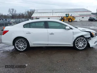 2014 Buick LaCrosse Premium II with VIN 1G4GF5G39EF305460, listed as a IAAI auction lot 41951229 with 127,188 mi miles and . Bid and sale history available at DreamBid. Image 13.