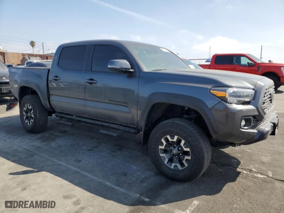 2022 Toyota Tacoma 4WD SR with VIN 3TMCZ5AN6NM511288, listed as a Copart auction lot 50429285 with 33,740 mi miles and Salvage Title. Bid and sale history available at carsss.com. Image 4.