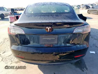 2021 Tesla Model 3 Standard Range Plus with VIN 5YJ3E1EA2MF977007, listed as a Copart auction lot 48516075 with Not Provided miles and Salvage Title. Bid and sale history available at DreamBid. Image 6.