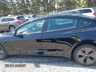 2022 Tesla Model 3 Long Range with VIN 5YJ3E1EB7NF241996, listed as a IAAI auction lot 42115915 with 23,433 mi miles and . Bid and sale history available at DreamBid. Image 14.