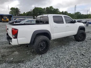 2021 Toyota Tacoma SR с VIN 3TMCZ5AN4MM386662, выставлен на аукционе Copart как лот 56954865 с пробегом 70 623 миль миль и Списание • Salvage title. История ставок и продаж доступна на DreamBid. Изображение 3.