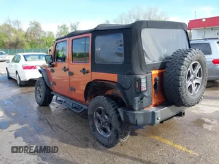 2010 Jeep Wrangler Unlimited Sport with VIN 1J4HA3H1XAL189667, listed as a IAAI auction lot 42062351 with 144,838 mi miles. Bid and sale history available at carsss.com. Image 3.