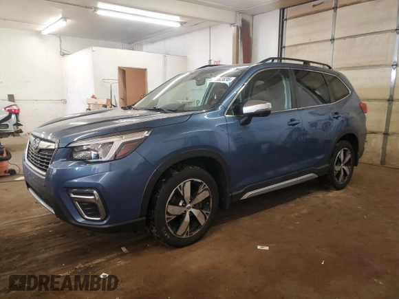 2021 Subaru Forester Touring z VIN JF2SKAXC9MH517699, wystawiony jako Copart lot #58962835 z przebiegiem 60 984 mil mil oraz Szkoda całkowita • Salvage title. Historia ofert i sprzedaży dostępna na DreamBid. Obrazek 1.