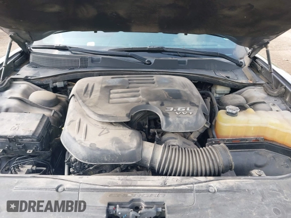 2015 Dodge Charger SXT with VIN 2C3CDXHG7FH886502, listed as a IAAI auction lot 42072027 with 105,034 mi miles and . Bid and sale history available at DreamBid. Image 10.