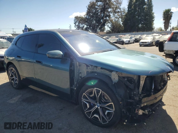 2023 BMW iX M60 with VIN WB533CF01PCM82043, listed as a Copart auction lot 47447815 with 9,058 mi miles and Salvage Title. Bid and sale history available at carsss.com. Image 4.