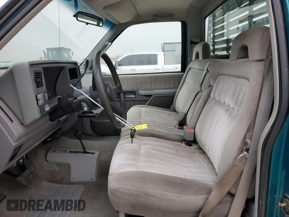 1994 GMC Sierra 1500 with VIN 1GTEK14K5RE539652, listed as a Copart auction lot 80877094 with 162,533 mi miles and Salvage Title. Bid and sale history available at DreamBid. Image 7.