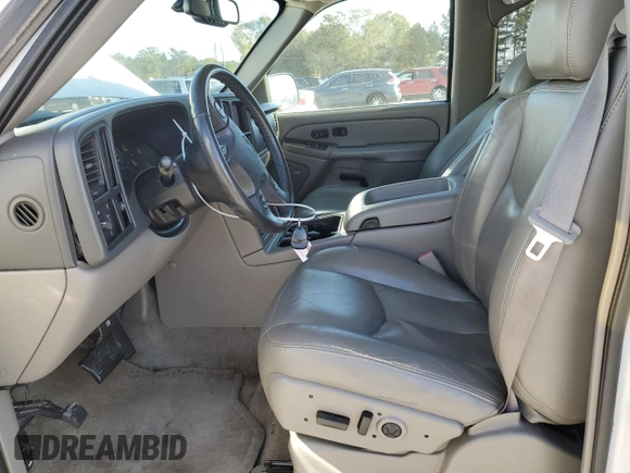 2005 GMC Yukon SLE with VIN 1GKEC13T15J230550, listed as a Copart auction lot 77214624 with 203,095 mi miles and Salvage Title. Bid and sale history available at carsss.com. Image 7.