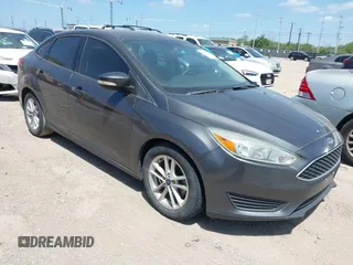 2016 Ford Focus SE z VIN 1FADP3F28GL281633, wystawiony jako IAAI lot #42459872 z przebiegiem 82 084 mil mil oraz . Historia ofert i sprzedaży dostępna na DreamBid. Obrazek 1.