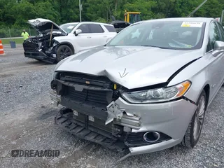 2013 Ford Fusion Titanium Hybrid with VIN 3FA6P0RU3DR281914, listed as a IAAI auction lot 42380838 with 166,956 mi miles and . Bid and sale history available at DreamBid. Image 6.