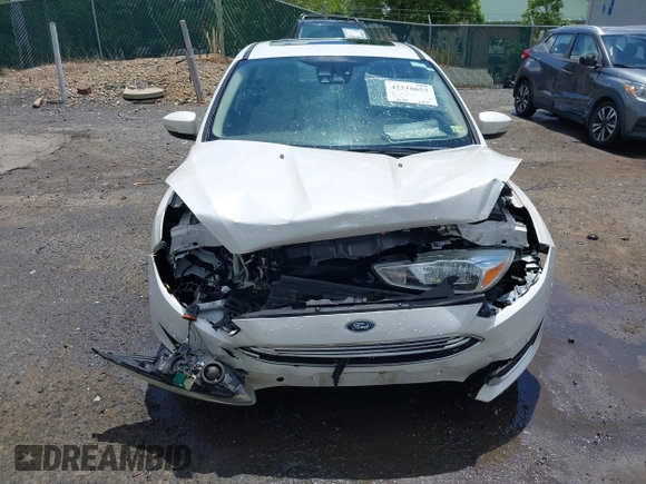 2016 Ford Focus Titanium with VIN 1FADP3N21GL309340, listed as a IAAI auction lot 42518653 with 101,555 mi miles and . Bid and sale history available at DreamBid. Image 12.