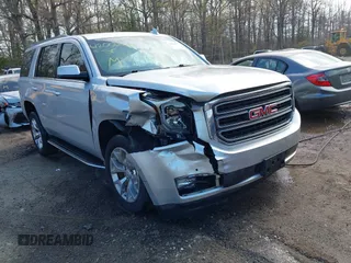 2015 GMC Yukon SLE with VIN 1GKS1AKC8FR540627, listed as a IAAI auction lot 42004023 with 128,195 mi miles. Bid and sale history available at carsss.com. Image 1.