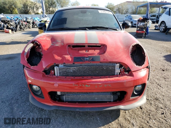 2015 MINI Coupe S z VIN WMWSX3C59FT409468, wystawiony jako Copart lot #71401384 z przebiegiem Nie podano mil oraz Szkoda całkowita • Salvage title. Historia ofert i sprzedaży dostępna na DreamBid. Obrazek 5.