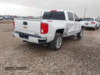 2018 Chevrolet Silverado 1500 High Country with VIN 3GCUKTEC1JG331991, listed as a IAAI auction lot 41718084 with 120,924 mi miles and . Bid and sale history available at DreamBid. Image 4.