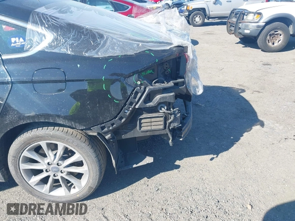 2018 Ford Fusion Energi SE with VIN 3FA6P0PU8JR152890, listed as a IAAI auction lot 41682965 with 84,890 mi miles. Bid and sale history available at carsss.com. Image 6.