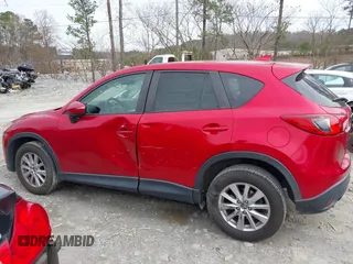 2016 Mazda CX-5 Touring z VIN JM3KE2CY3G0894441, wystawiony jako IAAI lot #41508767 z przebiegiem 88 554 mil mil oraz . Historia ofert i sprzedaży dostępna na DreamBid. Obrazek 14.