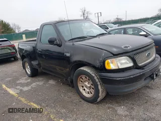 2001 Ford F-150 XL with VIN 2FTZF07211CA54107, listed as a IAAI auction lot 41450483 with 153,699 mi miles. Bid and sale history available at carsss.com. Image 1.