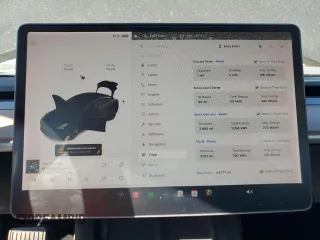 2021 Tesla Model 3 Standard Range Plus with VIN 5YJ3E1EA3MF996701, listed as a Copart auction lot 47013195 with 34,177 mi miles and Salvage Title. Bid and sale history available at carsss.com. Image 9.