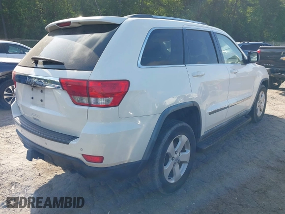 2011 Jeep Grand Cherokee Laredo with VIN 1J4RS4GGXBC517068, listed as a IAAI auction lot 42173780 with 170,688 mi miles and . Bid and sale history available at DreamBid. Image 4.