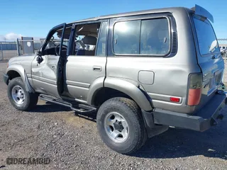 1997 Toyota Land Cruiser with VIN JT3HJ85JXV0174430, listed as a IAAI auction lot 41502690 with 300,632 mi miles. Bid and sale history available at carsss.com. Image 3.