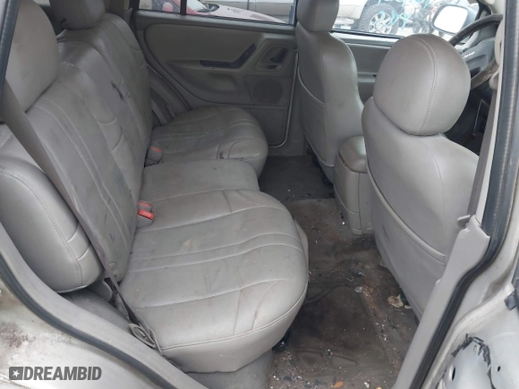 2004 Jeep Grand Cherokee Laredo with VIN 1J4GX48S44C301120, listed as a IAAI auction lot 41281556 with 267,246 mi miles. Bid and sale history available at carsss.com. Image 8.