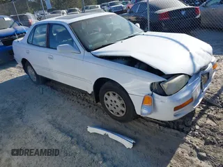 1996 Toyota Camry DX z VIN 4T1BG12K7TU950826, wystawiony jako IAAI lot #42041753 z przebiegiem 290 587 mil mil oraz . Historia ofert i sprzedaży dostępna na DreamBid. Obrazek 1.