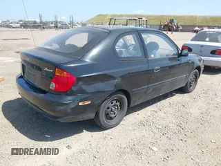 2003 Hyundai Accent with VIN KMHCF35CX3U271513, listed as a IAAI auction lot 42083235 with 166,240 mi miles. Bid and sale history available at carsss.com. Image 4.