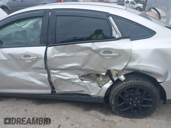 2015 Ford Focus SE with VIN 1FADP3F29FL258781, listed as a IAAI auction lot 41963223 with 121,286 mi miles and . Bid and sale history available at DreamBid. Image 6.