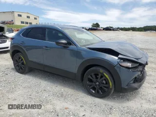 2023 Mazda CX-30 Premium with VIN 3MVDMBDY1PM509621, listed as a Copart auction lot 58316715 with 27,979 mi miles and Salvage title. Bid and sale history available at DreamBid. Image 4.