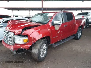 2015 GMC Canyon 2WD SLT with VIN 1GTG5CE39F1225427, listed as a IAAI auction lot 41453753 with 115,801 mi miles. Bid and sale history available at carsss.com. Image 2.