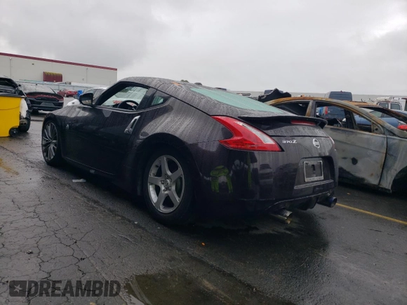 2010 Nissan 370Z Touring with VIN JN1AZ4EH6AM504310, listed as a Copart auction lot 82440524 with Not Provided miles and Salvage Title. Bid and sale history available at carsss.com. Image 2.