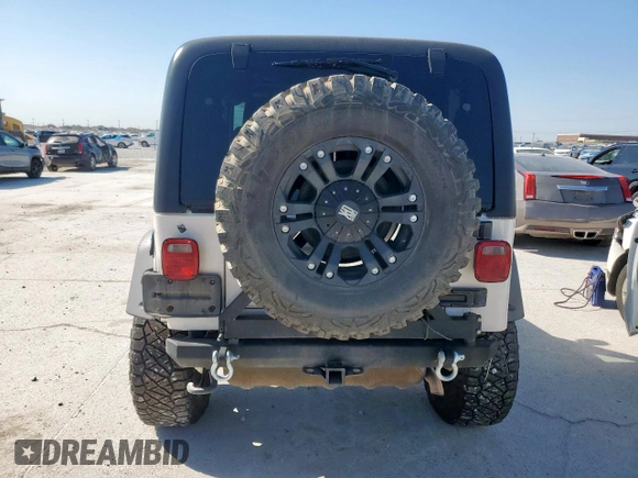 2004 Jeep Wrangler Rubicon z VIN 1J4FA69S34P757352, wystawiony jako Copart lot #52971745 z przebiegiem 139 855 mil mil oraz Szkoda całkowita • Salvage title. Historia ofert i sprzedaży dostępna na DreamBid. Obrazek 6.