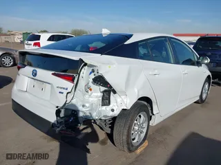 2021 Toyota Prius L Eco with VIN JTDKAMFU7M3133544, listed as a IAAI auction lot 41548653 with 115,214 mi miles. Bid and sale history available at carsss.com. Image 6.