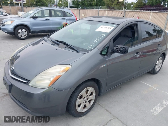 2007 Toyota Prius z VIN JTDKB20U573236900, wystawiony jako IAAI lot #42375325 z przebiegiem Nie podano mil oraz . Historia ofert i sprzedaży dostępna na DreamBid. Obrazek 6.