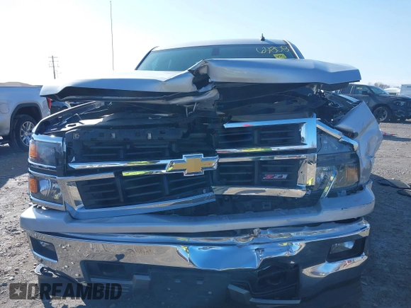 2014 Chevrolet Silverado 1500 LT with VIN 1GCVKREC0EZ151088, listed as a IAAI auction lot 41763808 with 124,668 mi miles and . Bid and sale history available at DreamBid. Image 12.