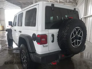 2024 Jeep Wrangler Rubicon with VIN 1C4PJXFG7RW334190, listed as a IAAI auction lot 42332948 with 14,272 mi miles and . Bid and sale history available at DreamBid. Image 3.