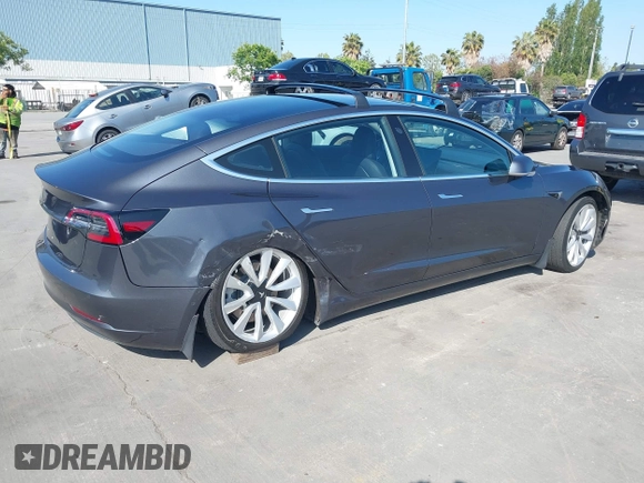2018 Tesla Model 3 Long Range Battery with VIN 5YJ3E1EA4JF024102, listed as a IAAI auction lot 42100621 with 86,298 mi miles and . Bid and sale history available at DreamBid. Image 4.
