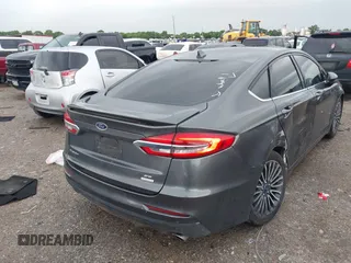 2020 Ford Fusion SE z VIN 3FA6P0HD5LR198744, wystawiony jako IAAI lot #42177820 z przebiegiem 97 520 mil mil oraz . Historia ofert i sprzedaży dostępna na DreamBid. Obrazek 4.