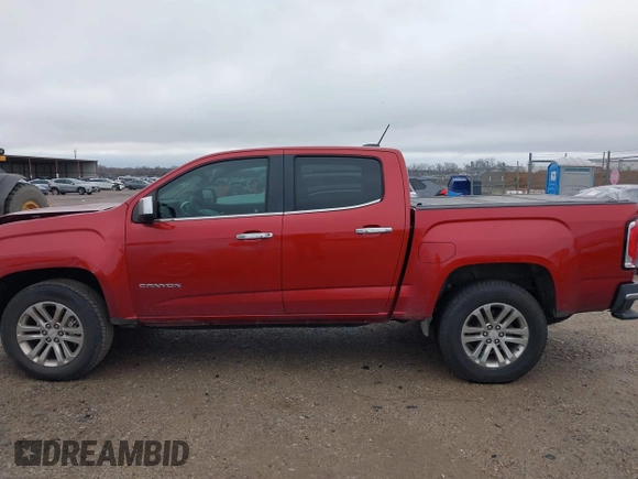 2015 GMC Canyon 2WD SLT with VIN 1GTG5CE3XF1211164, listed as a IAAI auction lot 41490387 with 163,932 mi miles. Bid and sale history available at carsss.com. Image 14.