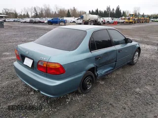 2000 Honda Civic LX with VIN 1HGEJ6677YL000793, listed as a IAAI auction lot 41889317 with 184,766 mi miles. Bid and sale history available at carsss.com. Image 4.