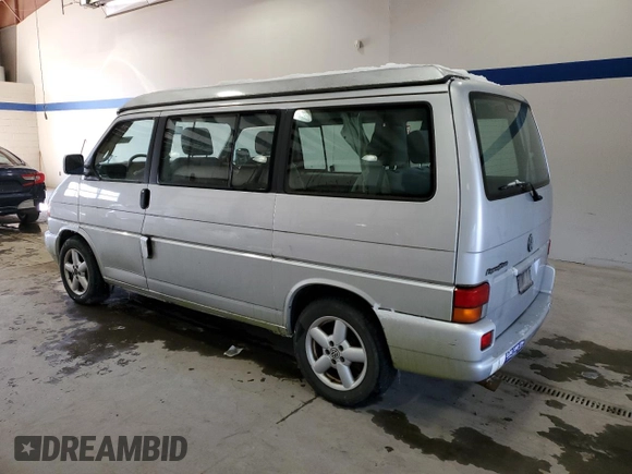 2003 Volkswagen EuroVan MV с VIN WV2NB47073H001005, выставлен на аукционе Copart как лот 87284844 с пробегом 283 979 миль миль и Чистый • Clean title. История ставок и продаж доступна на DreamBid. Изображение 2.