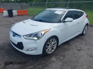 2012 Hyundai Veloster w/Gray Int z VIN KMHTC6ADXCU050034, wystawiony jako IAAI lot #42506584 z przebiegiem 142 514 mil mil oraz . Historia ofert i sprzedaży dostępna na DreamBid. Obrazek 6.