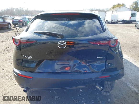 2022 Mazda CX-30 S with VIN 3MVDMBALXNM402265, listed as a IAAI auction lot 41458605 with 76,291 mi miles and . Bid and sale history available at carsss.com. Image 16.