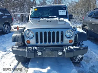 2013 Jeep Wrangler Unlimited Sport with VIN 1C4BJWDGXDL651995, listed as a IAAI auction lot 41578040 with 114,698 mi miles. Bid and sale history available at carsss.com. Image 12.